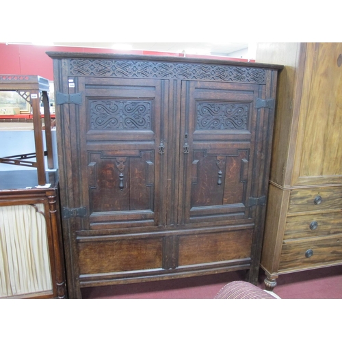 1508 - A XVII Century Joined Oak Livery Cupboard, with carved frieze, twin cupboard doors and panelled base... 