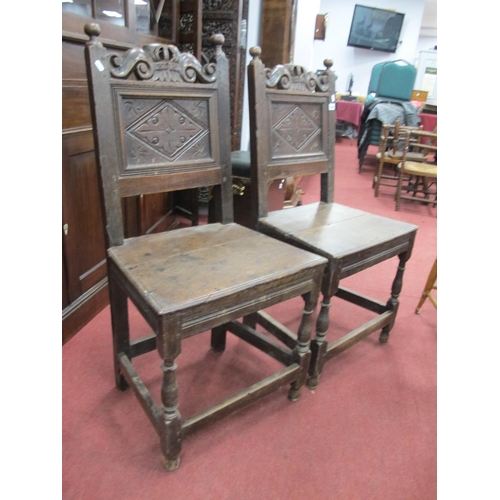 1556 - A Pair of XVII Century Joined Oak Back Stools, with finial tops, 'S' shaped rail over a back panel w... 