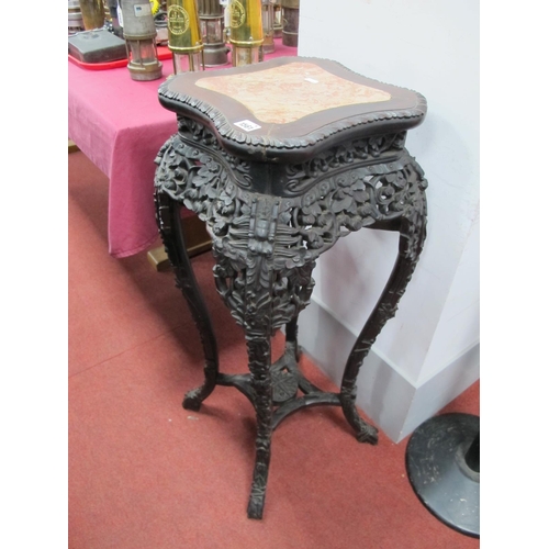 1561 - A Late XIX Century Chinese Hardwood Jardiniére Stand, the square top inset with rouge marble within ... 