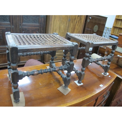 1562 - A Pair of 1920's Oak Stools, with caned tops on turned and block supports united by turned stretcher... 