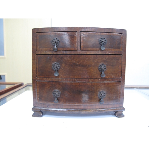 1206 - An XVIII Century Style Miniature Bow Fronted Chest of Drawers, of two short and two long drawers rai... 