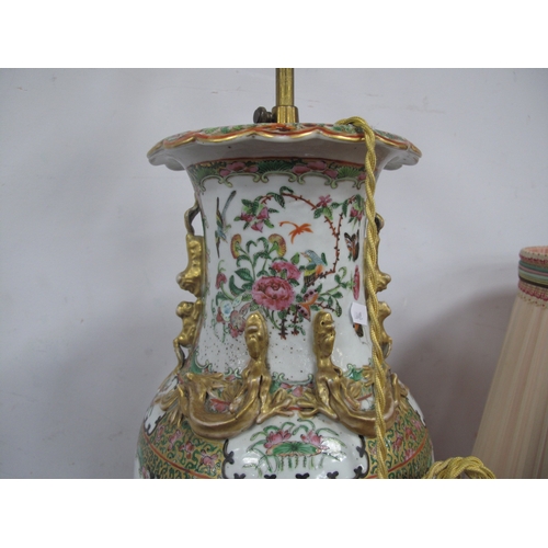 1149 - A Chinese Canton Famille Rose Vase, converted to a table lamp with shade, the panels profusely decor... 