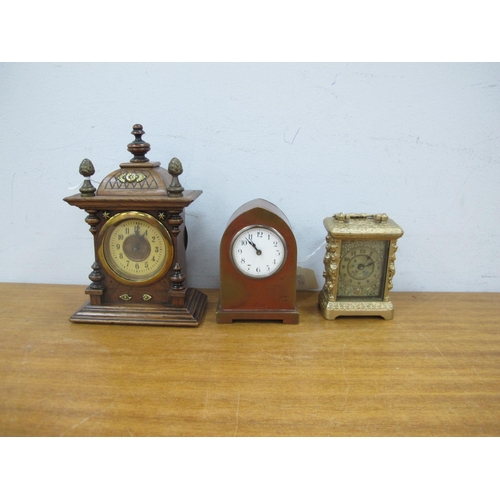 1435 - An Early XX Century Brass Arched Cased Bedside Clock, 9.5cm high, walnut cased mantle clock and a Tr... 