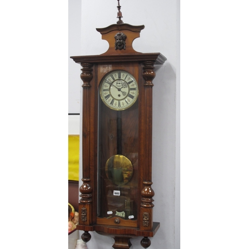 1665 - A XIX Century Viennese Wall Clock, in walnut case with thirty hour movement, seconds dial, mask pedi... 