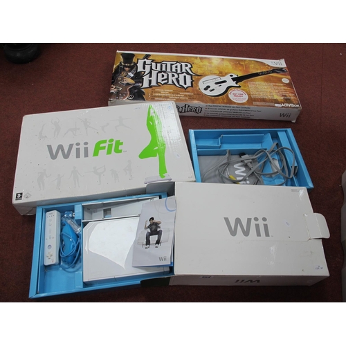 554 - Three Boxed Nintendo WII Items, comprising of a gaming console, WII fit balance board, guitar hero w... 