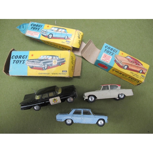 679 - Three Corgi Toys Diecast Model Cars, comprising of #217 Fiat 1800 light blue with lemon interior, ma... 