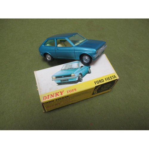 686 - A Dinky Toys (Made in Spain) #011541 Diecast Model Ford Fiesta. metallic light blue body, cream inte... 