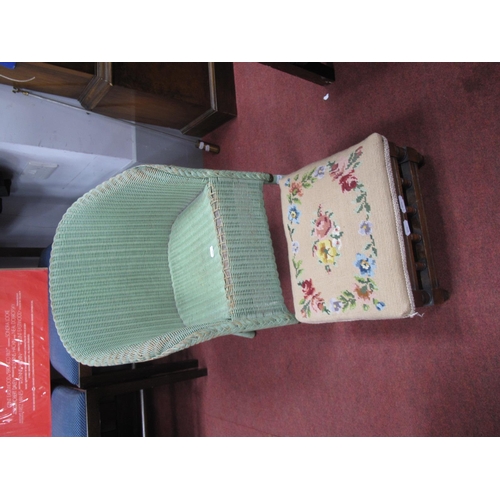 1606 - A XX Century Green Painted Lloyd Loom Style Child's Chair, together with a foot stool. (2)