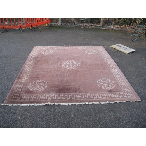 1562 - A Chinese Wool Tassled Carpet, with floral motifs, within Swastika border, on brown ground, no visib... 