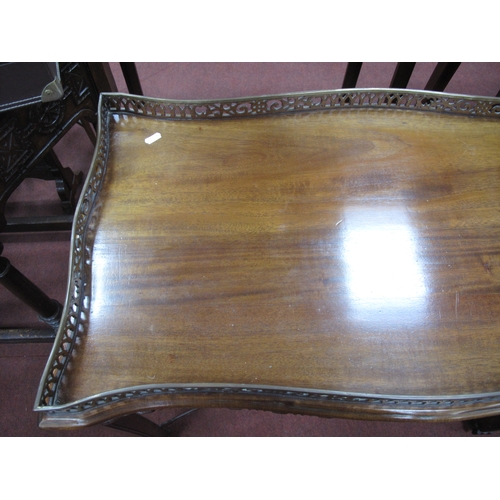 1582 - A Chippendale Style Mahogany Silver Table, with a pierced gallery on square supports, united by pier... 