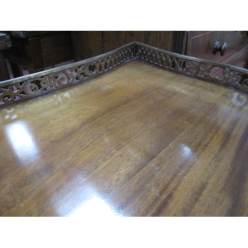 1582 - A Chippendale Style Mahogany Silver Table, with a pierced gallery on square supports, united by pier... 