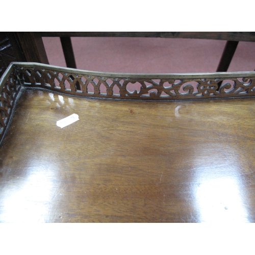 1582 - A Chippendale Style Mahogany Silver Table, with a pierced gallery on square supports, united by pier... 