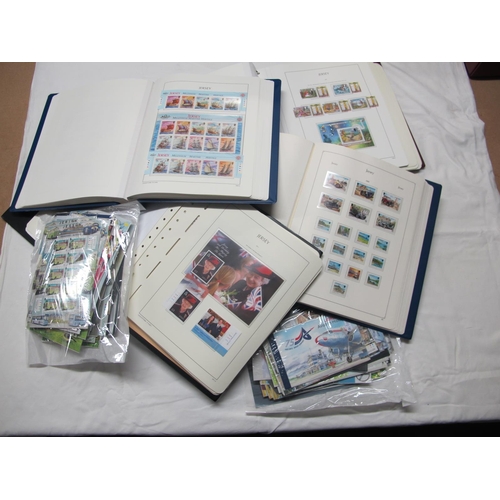 40 - A Large Collection of Jersey Stamps and Mini Sheets, housed in four luxury albums and loose in packe... 