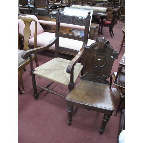 1611 - A XIX Century Oak Hall Chair, with a solid seat, on turned forefront legs, together with an oak armc... 