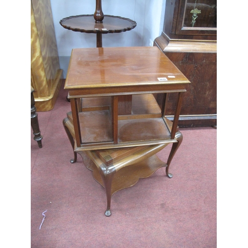 1612 - Am Early XX Century Mahogany Revolving Bookcase, with a square top, open shelves, base with cabriole... 