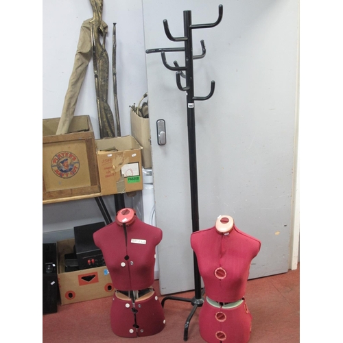 1002 - A Black Metal Hat and Coat Stand, on cruciform base, 175cm high, two fabric mannequin torsos. (3).