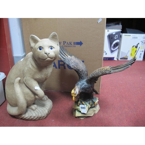 1045 - Reconstructed Figure of a Seated Cat; cat 40cm high; together with a resin figure of an eagle.