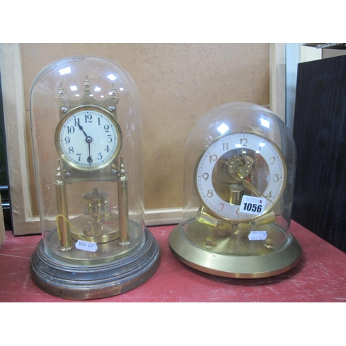 1056 - Anniversary Clock, under a glass dome; together with one other mantel clock. (2)