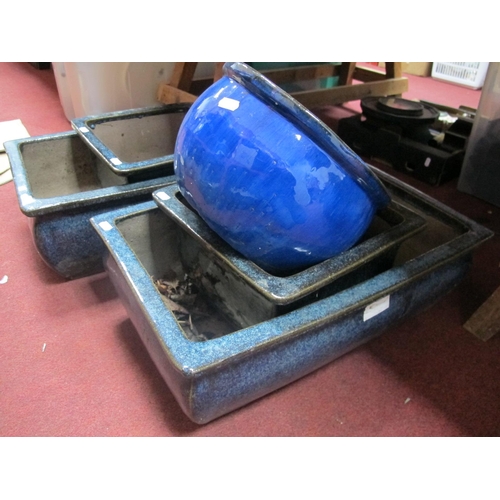 1122 - Two Blue Glazed Rectangular Planters, 54cm wide, two square and one circular example. (5)