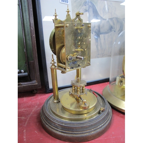 1056 - Anniversary Clock, under a glass dome; together with one other mantel clock. (2)