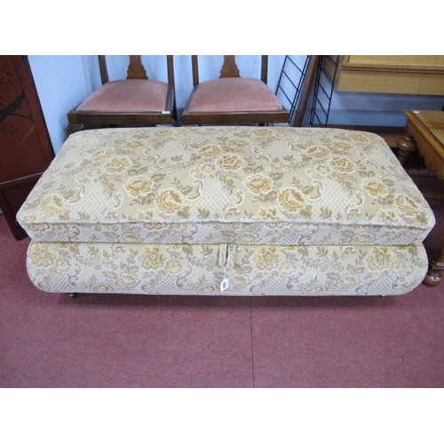 1532 - A XX Century Upholstered Rectangular Shaped Ottoman, with a hinged lid, on bum feet, 130cm wide.