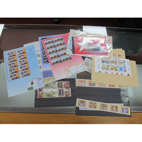 40 - A Large Collection of Jersey Stamps and Mini Sheets, housed in four luxury albums and loose in packe... 