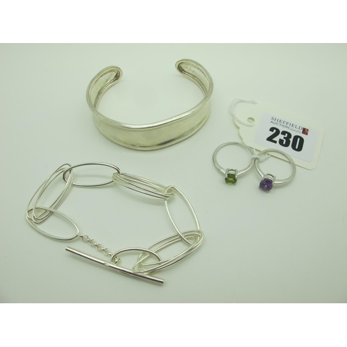 230 - A Modern Hallmarked Silver Cuff Bangle, together with a modern oval link bracelet with T-bar fastene... 
