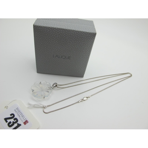 231 - Lalique; A Modern Glass Flowerhead Pendant, claw set stamped 