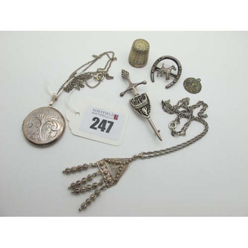 247 - A Hallmarked Silver Circular Locket Pendant, a Scottish hallmarked silver sword brooch, a Dorcas thi... 