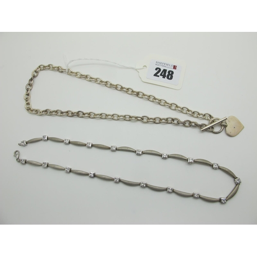 248 - A Modern Necklace, composed of shaped satin finish links and square collet set highlights, stamped 