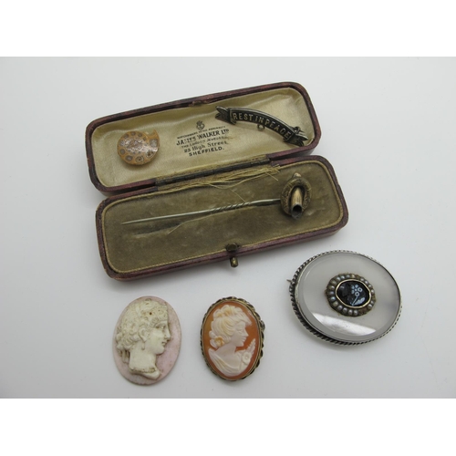 261 - A Victorian Oval Panel Brooch, collet set; together with an oval shell carved cameo brooch / pendant... 