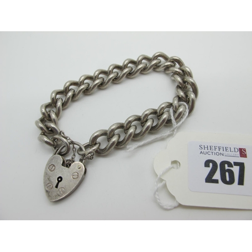 267 - A Solid Curb Link Bracelet, to a hallmarked silver heart shape padlock style clasp.