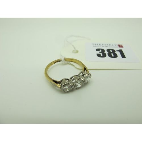 381 - A Three Stone Diamond Ring, claw set throughout, between plain shoulders, stamped 