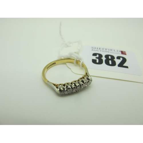 382 - A Five Stone Diamond Ring, claw set with graduated old cut stones, stamped 