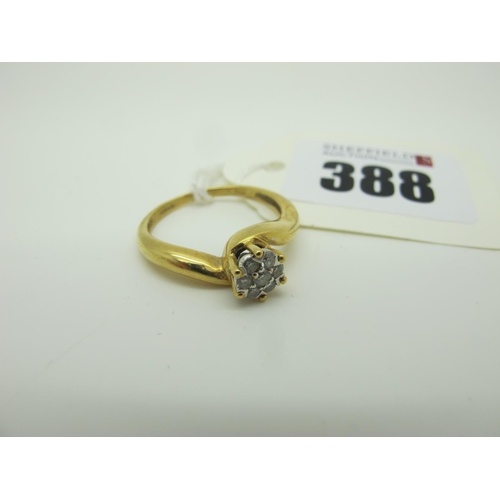 388 - A Modern Diamond Cluster Ring, claw set with brilliant cut stones, between crossover shoulders, stam... 