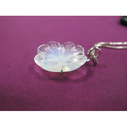 231 - Lalique; A Modern Glass Flowerhead Pendant, claw set stamped 
