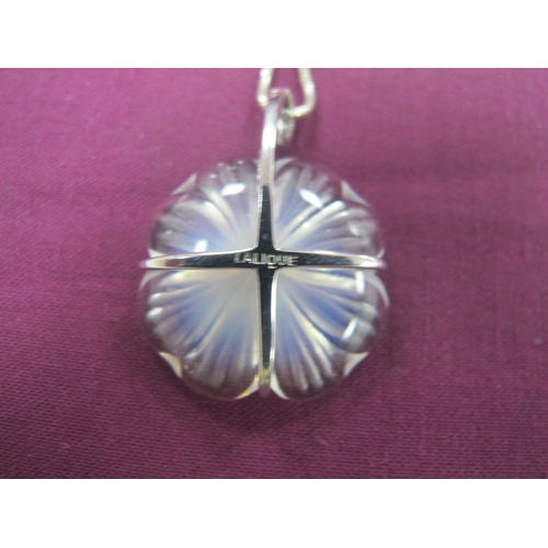 231 - Lalique; A Modern Glass Flowerhead Pendant, claw set stamped 