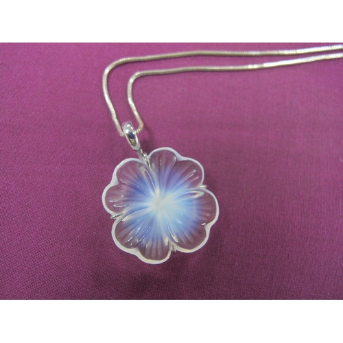 231 - Lalique; A Modern Glass Flowerhead Pendant, claw set stamped 