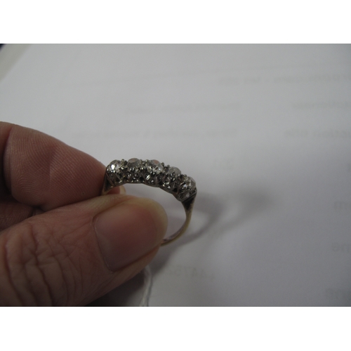 358 - A Five Stone Diamond Ring, the old cut stones claw set between tapered shoulders, stamped 