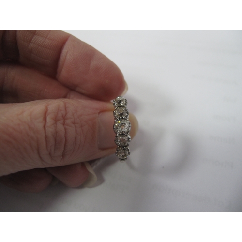 358 - A Five Stone Diamond Ring, the old cut stones claw set between tapered shoulders, stamped 