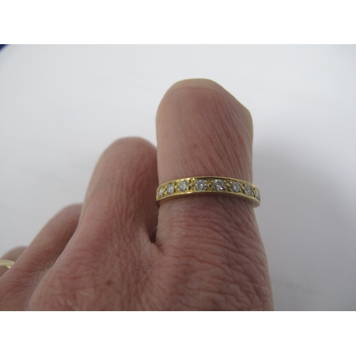 369 - A Diamond Set Half Eternity Style Ring, millegrain set with uniform brilliant cut stones, stamped 