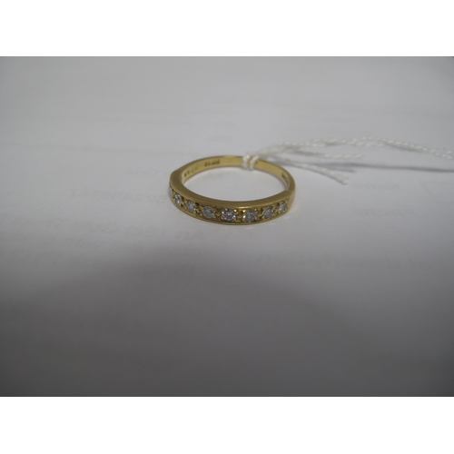 369 - A Diamond Set Half Eternity Style Ring, millegrain set with uniform brilliant cut stones, stamped 