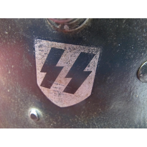 531 - A WWII Era Austrian M16 SS Double Decal Helmet, with liner and chin strap, dome of helmet stamped wi... 