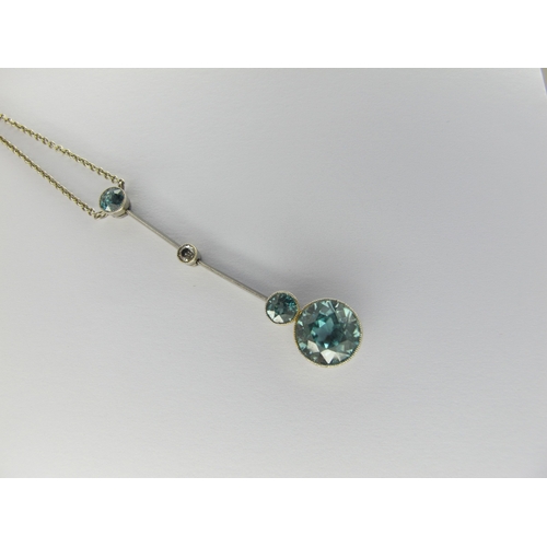 125 - A Vintage Blue Zircon and Diamond Set Drop Necklace, graduated circular collet set, on knife edge ba... 