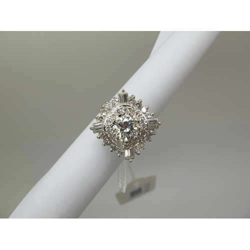 185 - A Large Diamond Cluster Cocktail Ring, claw and collet set throughout with graduated brilliant and b... 