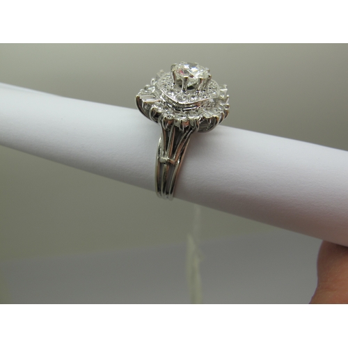 185 - A Large Diamond Cluster Cocktail Ring, claw and collet set throughout with graduated brilliant and b... 