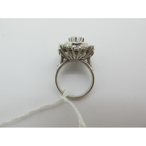 185 - A Large Diamond Cluster Cocktail Ring, claw and collet set throughout with graduated brilliant and b... 