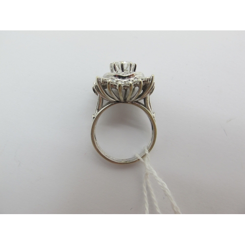 185 - A Large Diamond Cluster Cocktail Ring, claw and collet set throughout with graduated brilliant and b... 