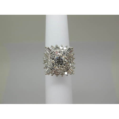 185 - A Large Diamond Cluster Cocktail Ring, claw and collet set throughout with graduated brilliant and b... 