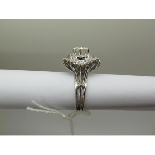 185 - A Large Diamond Cluster Cocktail Ring, claw and collet set throughout with graduated brilliant and b... 